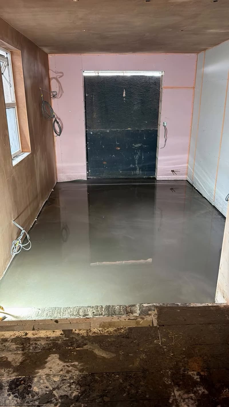 Fresh screed floor laid in the rear of the house